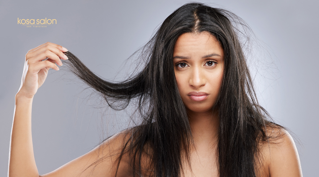 Girl frustrated with frizzy balayage hair caused by high humidity