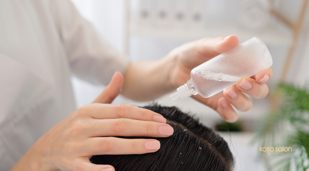 Woman applying deep conditioning treatment during winter to protect hair and scalp from dryness and flaking